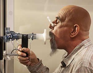 Man having pulmonary function tests.