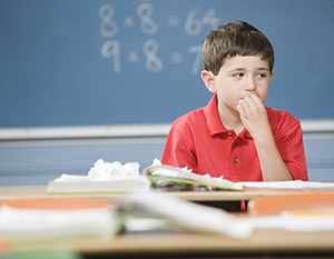 Boy not paying attention in classroom.